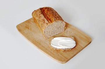  rye bread with butter on wooden board