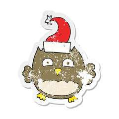 retro distressed sticker of a cartoon owl wearing christmas hat