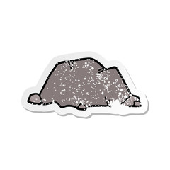 distressed sticker of a cartoon rock