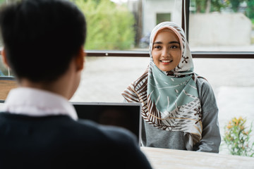 veiled women interviewed as new employees by the owner of the company in the midday