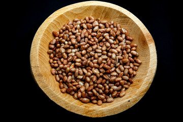 Carioca Beans into a bowl. Agriculture, seed.