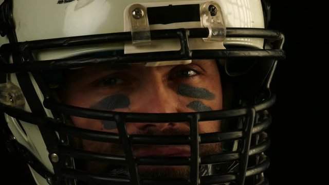 Close up portrait of American Football Player in helmet