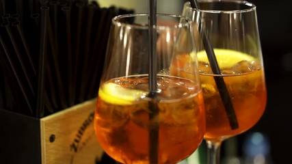 Two cocktail beverages with ice & lemon on a wedding night