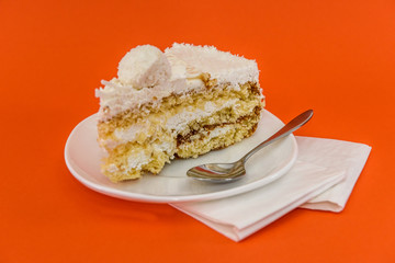 Piece of cake isolated on orange close up