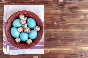 Obraz na płótnie Canvas Easter composition with eggs on wooden background. Top view, copy space.