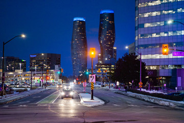 Fototapeta na wymiar Mississauga, Canada, February 14, 2019: Twin towers of Absolute Condos in, these high-rise Mississauga condos were built in 2007 by Fernbrook Homes. Located in Mississauga's City Centre neighbourhood