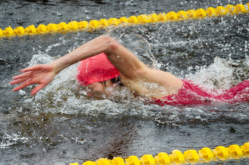 Lovers of winter swimming.Swimmer swims in the pool.