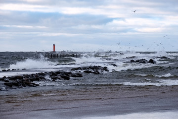 moderate storm in baltic sea near lighthouse