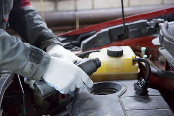 Mechanic changing oil