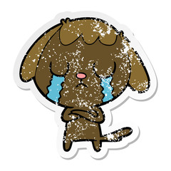 distressed sticker of a cute cartoon dog crying