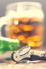Bottle opener and beer on the bar.