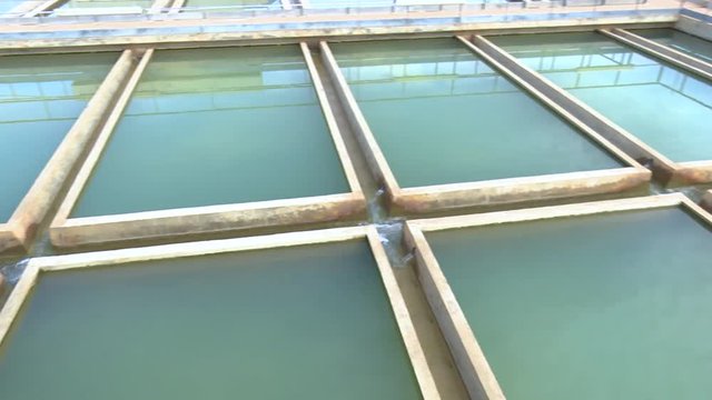 Pan On Unrecognizable Water Sedimentation Tanks In A Water Treatment Plant Located In Africa