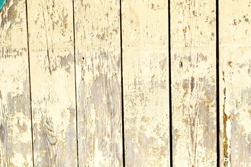 old wwoden plank wall with pealing paint