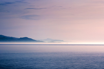 Sunlit fog on a coastline