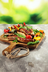 Fototapeta na wymiar Assorted delicious grilled meat with vegetable on a barbecue. Grilled pork shish or kebab on skewers with vegetables . Food background shashlik