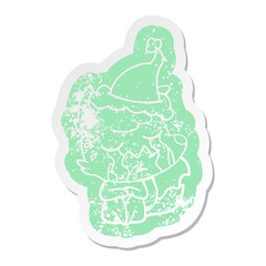 crying fox cartoon distressed sticker of a wearing santa hat