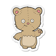 sticker of a cartoon teddy bear waving
