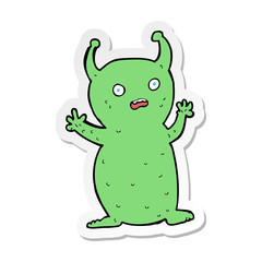 sticker of a cartoon funny little alien