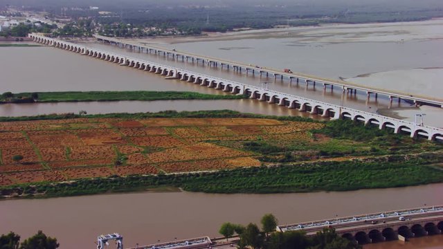 Aerial view of twins bridges, twin canals both sides of the river, big canals starting from the river going between the city, Traffic is going on, Khyberpakhtunkhwa, Pakistan
