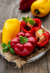 Plate with Bell peppers on a wooden background