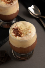 Coffee affogato with vanilla ice cream and espresso. Glass with coffee drink and icecream. Copy space.