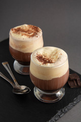 Coffee affogato with vanilla ice cream and espresso. Glass with coffee drink and icecream. Copy space.