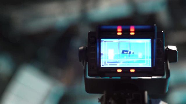 A colorful shallow depth of field moving shot of a TV Studio camera monitor.