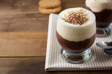 Coffee affogato with vanilla ice cream and espresso. Glass with coffee drink and icecream.