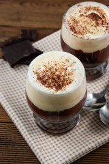 Coffee affogato with vanilla ice cream and espresso. Glass with coffee drink and icecream.