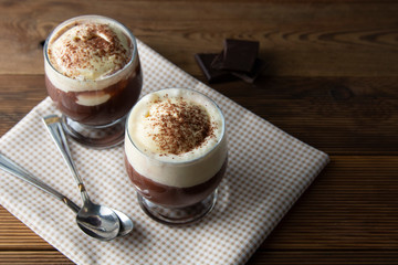 Coffee affogato with vanilla ice cream and espresso. Glass with coffee drink and icecream.