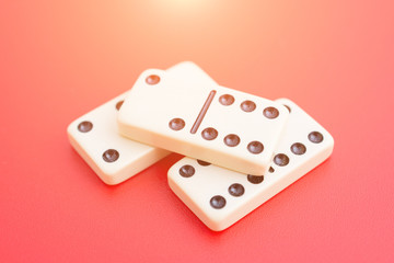 Dominoes on red table