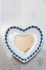 Heart shaped saucer filled with tea