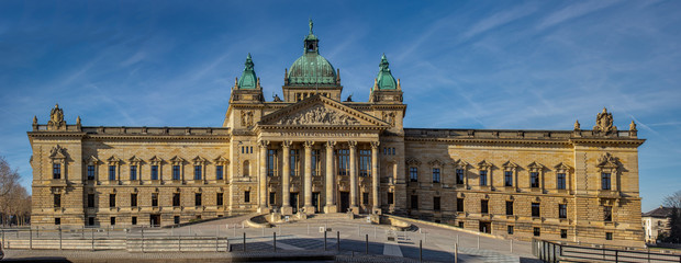 Fototapeta na wymiar Panorama of the Federal Administrative Court Leipzig - Germany at blue sky.At the courthouse is the text Federal Administrative Court in German