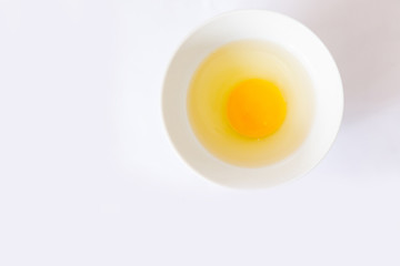whole egg broken egg with egg shells in a bowl with white background