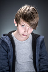 Fototapeta premium Studio portrait of a handsome and expressive young boy