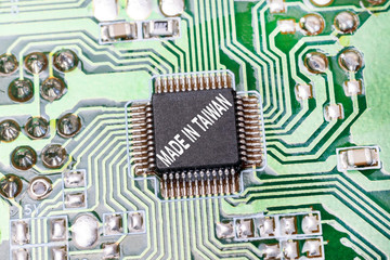 macro photography motherboard from computer. close-up. there is an inscription on it. made in taiwan