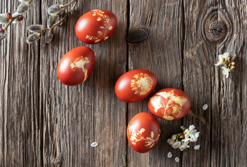 Easter eggs dyed with onion peels, with a pattern of fresh herbs