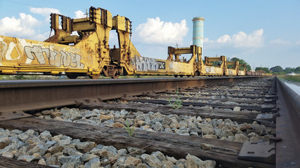 Graffiti on Train Cars on Tracks