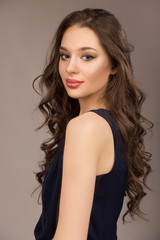 Portrait of a young woman with beautiful make-up and hairstyle