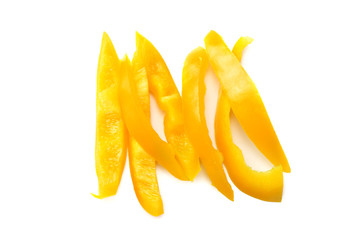 Naklejka na ściany i meble cut slices of yellow sweet bell pepper isolated on white background top view