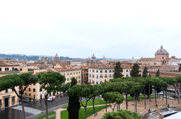 Fototapeta na wymiar view of Rome on a cloudy day, buildings in Rome, pine trees, Rome street,