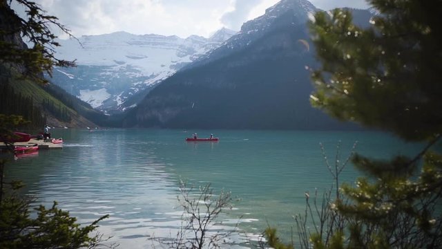 People canoeing on Lake Louise in British Columbia.