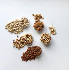 Healthy food. Nuts mix assortment on stone table top view. Collection of different legumes for background image close up nuts, pistachios, almond, cashew nuts, peanut, walnut. image