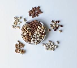 Healthy food. Nuts mix assortment on stone table top view. Collection of different legumes for background image close up nuts, pistachios, almond, cashew nuts, peanut, walnut. image