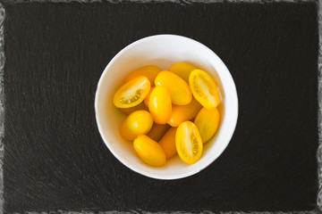 Exotic tomatoes rosa yellow tomatoes on a black background