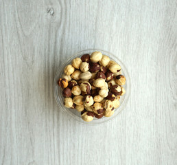 Healthy food  for background image close up hazelnuts.  Nuts texture on white grey table top view