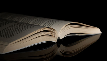 Book. Opened. Side. Light. Reflection. Black