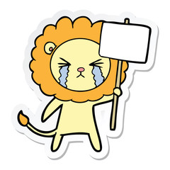 sticker of a cartoon crying lion with placard
