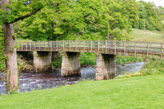 Stone foorbridge over the River Wharfe at Bolton Abbey in the Yorkshire Dales