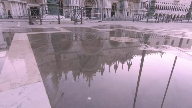 St Mark&acute;s Basilica in Venice Italy at sunrise with no people and a beautiful sunrise.